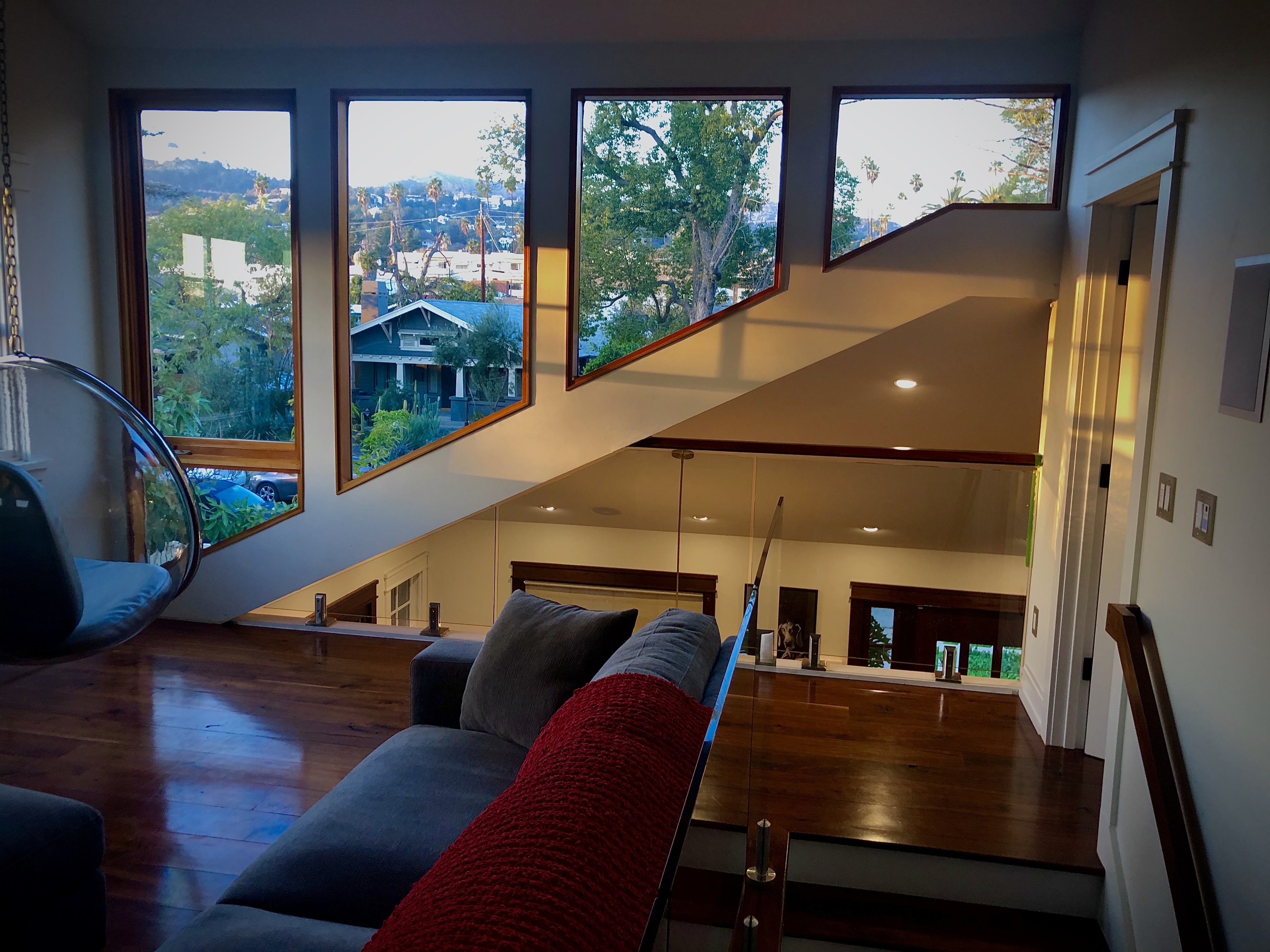 Den with view and glass railing